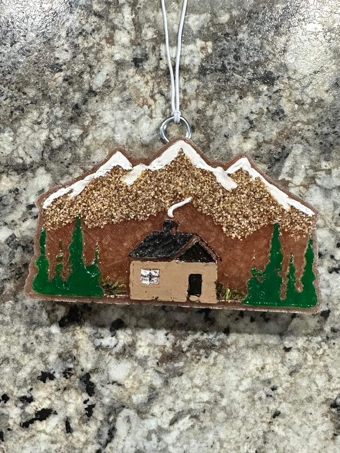 Cabin with trees and mountains