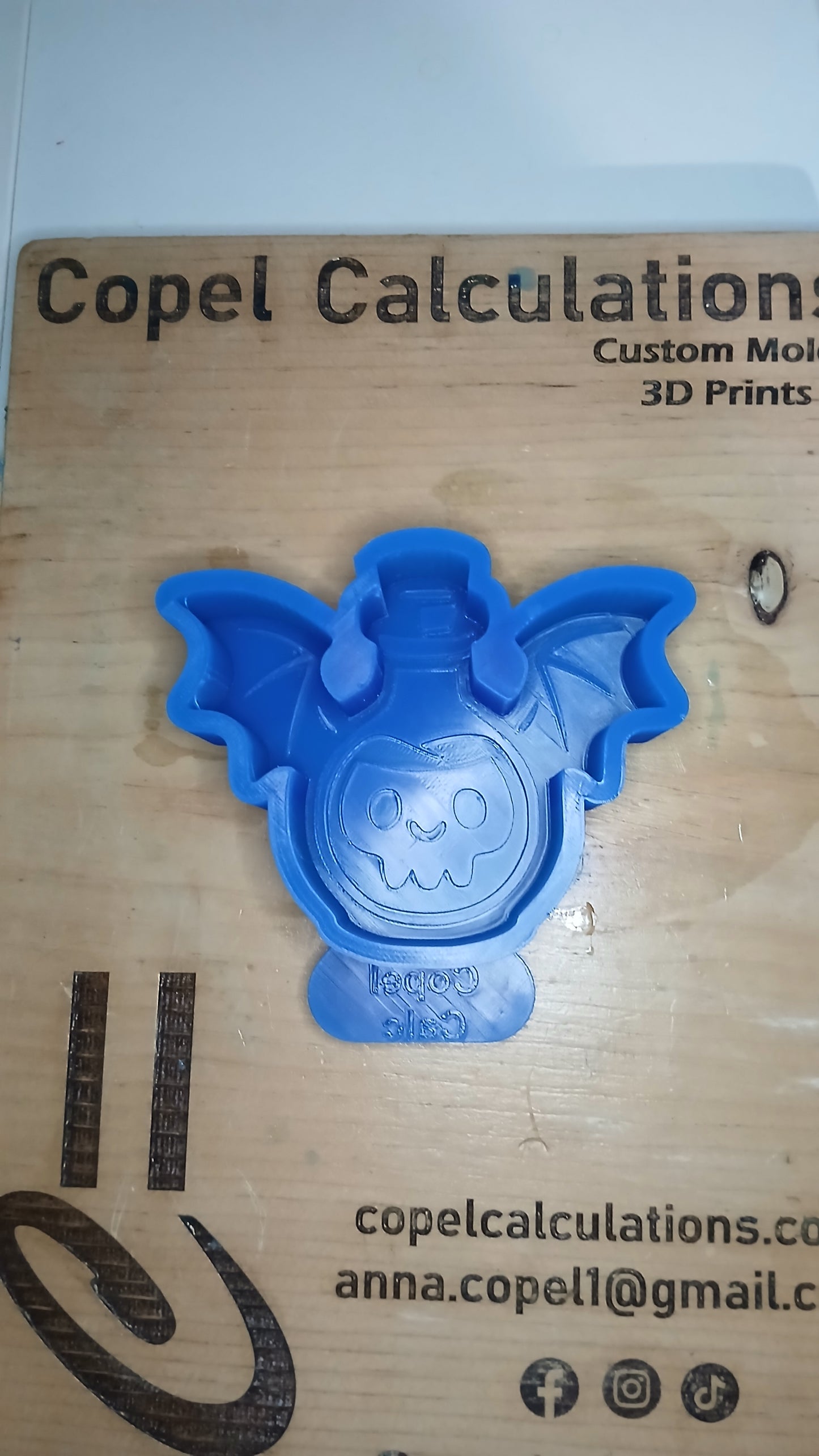 Potion Bottle with Wings and Skull